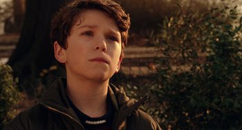 Movie still from “Night at the Museum” (2006), directed by Shawn Levy – A young boy is looking into the distance; Close Up shot, Low angle