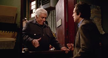 Movie still from “Night at the Museum” (2006), directed by Shawn Levy – Two men talking to each other in a room; Medium shot, Over the shoulder angle