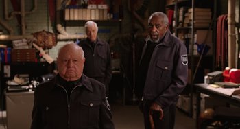 Movie still from “Night at the Museum” (2006), directed by Shawn Levy – A group of men standing next to each other in a room; Medium shot, Low angle