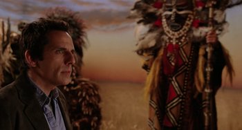 Movie still from “Night at the Museum” (2006), directed by Shawn Levy – A man standing in front of two native american statues; Medium shot, Over the shoulder angle