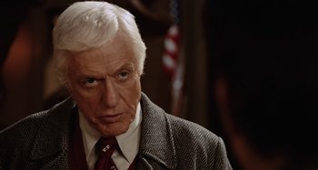 Movie still from “Night at the Museum” (2006), directed by Shawn Levy – An older man in a suit and red tie; Close Up shot, Over the shoulder angle