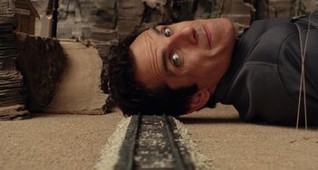 Movie still from “Night at the Museum” (2006), directed by Shawn Levy – A man laying on the ground with his head on the ground; Close Up shot, Overhead angle