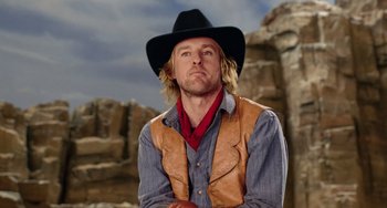Movie still from “Night at the Museum” (2006), directed by Shawn Levy – A man wearing a cowboy hat and a leather vest; Close Up shot, Low angle