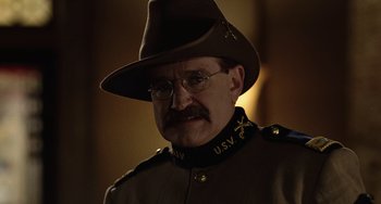 Movie still from “Night at the Museum” (2006), directed by Shawn Levy – A person wearing a uniform and a hat; Close Up shot, Low angle