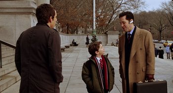 Movie still from “Night at the Museum” (2006), directed by Shawn Levy – Three people standing on a sidewalk talking to each other; Medium shot, Over the shoulder angle