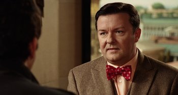 Movie still from “Night at the Museum” (2006), directed by Shawn Levy – A person wearing a suit and a bow tie; Close Up shot, Over the shoulder angle