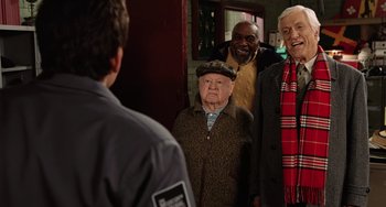 Movie still from “Night at the Museum” (2006), directed by Shawn Levy – A group of men standing next to each other in a room; Medium shot, Over the shoulder angle