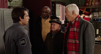 Movie still from “Night at the Museum” (2006), directed by Shawn Levy – A group of men standing next to each other in a room; Medium shot, Over the shoulder angle