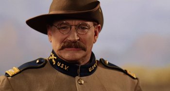 Movie still from “Night at the Museum” (2006), directed by Shawn Levy – An old man in a military uniform wearing glasses and a hat; Close Up shot, Low angle
