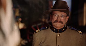 Movie still from “Night at the Museum” (2006), directed by Shawn Levy – A man in a uniform and a cowboy hat; Close Up shot, Over the shoulder angle
