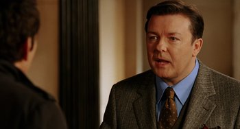 Movie still from “Night at the Museum” (2006), directed by Shawn Levy – A person wearing a suit and a tie; Close Up shot, Over the shoulder angle