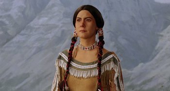 Movie still from “Night at the Museum” (2006), directed by Shawn Levy – A woman in a native american dress with braids; Close Up shot, Low angle