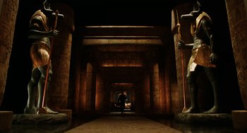 Movie still from “Night at the Museum” (2006), directed by Shawn Levy – A man standing in an empty room with pillars and statues; Extreme Wide shot, Low angle