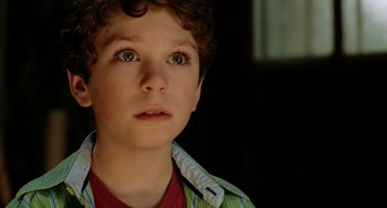 Movie still from “Night at the Museum” (2006), directed by Shawn Levy – A young boy looking up; Close Up shot, High angle