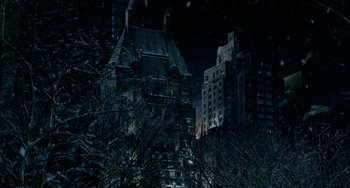 Movie still from “Night at the Museum” (2006), directed by Shawn Levy – A dark night with a building and trees in the foreground; Extreme Wide shot, Low angle