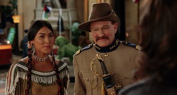 Movie still from “Night at the Museum” (2006), directed by Shawn Levy – A man and woman dressed in native american clothing; Medium shot, Over the shoulder angle