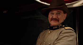 Movie still from “Night at the Museum” (2006), directed by Shawn Levy – An old man in a military uniform wearing a hat and glasses; Close Up shot, Over the shoulder angle