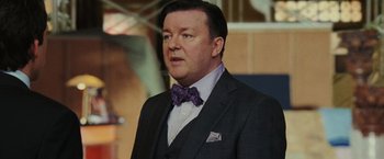Movie still from “Night at the Museum: Battle of the Smithsonian” (2009), directed by Shawn Levy – A person wearing a suit and a bow tie; Close Up shot, Over the shoulder angle