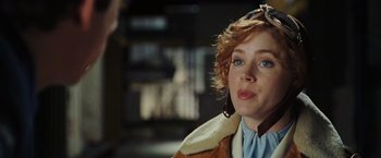 Movie still from “Night at the Museum: Battle of the Smithsonian” (2009), directed by Shawn Levy – A person with short red hair; Close Up shot, Over the shoulder angle