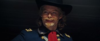 Movie still from “Night at the Museum: Battle of the Smithsonian” (2009), directed by Shawn Levy – A person wearing a uniform and a cowboy hat; Close Up shot, Low angle