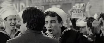 Movie still from “Night at the Museum: Battle of the Smithsonian” (2009), directed by Shawn Levy – A man wearing a sailor's hat talking to another man; Close Up shot, Over the shoulder angle