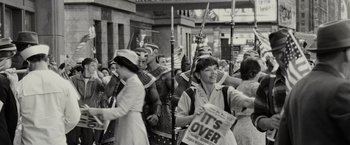 Movie still from “Night at the Museum: Battle of the Smithsonian” (2009), directed by Shawn Levy – A group of people in costumes walking down a street; Wide shot, Over the shoulder angle