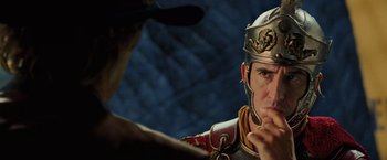 Movie still from “Night at the Museum: Battle of the Smithsonian” (2009), directed by Shawn Levy – A man wearing a roman soldier's helmet stares into a mirror; Close Up shot, Over the shoulder angle