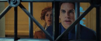 Movie still from “Night at the Museum: Battle of the Smithsonian” (2009), directed by Shawn Levy – A man and a woman looking through a fence; Close Up shot, Over the shoulder angle