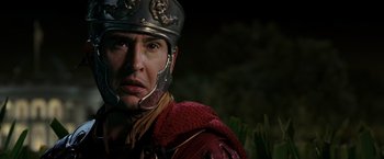 Movie still from “Night at the Museum: Battle of the Smithsonian” (2009), directed by Shawn Levy – A man wearing a helmet and a red jacket; Close Up shot, Low angle
