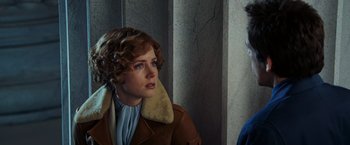 Movie still from “Night at the Museum: Battle of the Smithsonian” (2009), directed by Shawn Levy – A woman in a brown jacket and a man in a blue shirt; Close Up shot, Over the shoulder angle