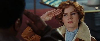 Movie still from “Night at the Museum: Battle of the Smithsonian” (2009), directed by Shawn Levy – A person saluting; Close Up shot, Over the shoulder angle