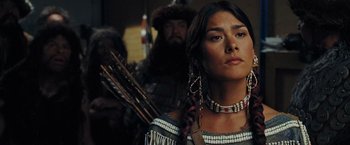 Movie still from “Night at the Museum: Battle of the Smithsonian” (2009), directed by Shawn Levy – A woman in native american clothing holding a bow and arrow; Close Up shot, Low angle