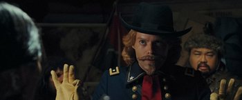 Movie still from “Night at the Museum: Battle of the Smithsonian” (2009), directed by Shawn Levy – A man with a beard and mustache wearing a hat; Close Up shot, Over the shoulder angle