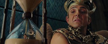 Movie still from “Night at the Museum: Battle of the Smithsonian” (2009), directed by Shawn Levy – A person wearing a costume; Close Up shot, Over the shoulder angle