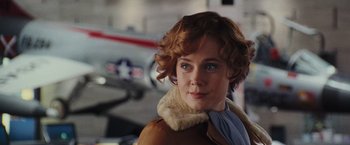 Movie still from “Night at the Museum: Battle of the Smithsonian” (2009), directed by Shawn Levy – A person wearing a jacket; Close Up shot, Over the shoulder angle