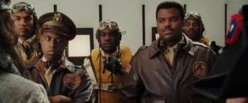 Movie still from “Night at the Museum: Battle of the Smithsonian” (2009), directed by Shawn Levy – A group of men standing next to each other in a room; Medium shot, Low angle