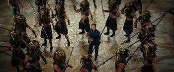 Movie still from “Night at the Museum: Battle of the Smithsonian” (2009), directed by Shawn Levy – A group of men in costumes are standing in a circle; Wide shot, High angle
