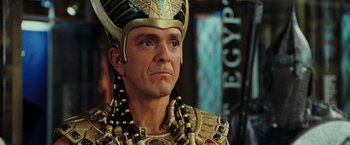 Movie still from “Night at the Museum: Battle of the Smithsonian” (2009), directed by Shawn Levy – A person wearing a costume; Close Up shot, Over the shoulder angle