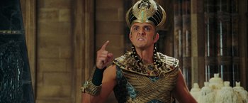 Movie still from “Night at the Museum: Battle of the Smithsonian” (2009), directed by Shawn Levy – A man dressed as a pharaoh pointing to the side; Close Up shot, Low angle