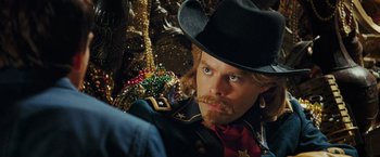 Movie still from “Night at the Museum: Battle of the Smithsonian” (2009), directed by Shawn Levy – A man in a cowboy hat with a beard; Close Up shot, Over the shoulder angle