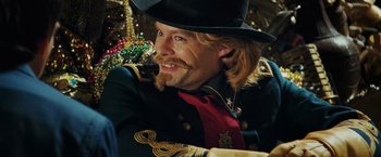 Movie still from “Night at the Museum: Battle of the Smithsonian” (2009), directed by Shawn Levy – A man with a beard and mustache wearing a top hat; Close Up shot, Over the shoulder angle