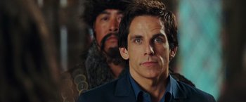 Movie still from “Night at the Museum: Battle of the Smithsonian” (2009), directed by Shawn Levy – A person wearing a suit and tie; Close Up shot, Over the shoulder angle