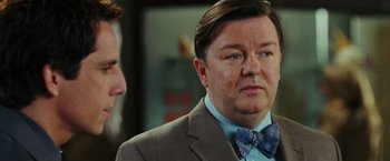 Movie still from “Night at the Museum: Battle of the Smithsonian” (2009), directed by Shawn Levy – A person wearing a suit and a bow tie; Close Up shot, Over the shoulder angle