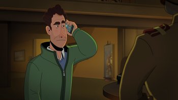 Movie still from “Night at the Museum: Kahmunrah Rises Again” (2022), directed by Justin Lovell – A man holding a cell phone up to his ear; Medium shot, Over the shoulder angle