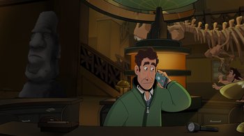 Movie still from “Night at the Museum: Kahmunrah Rises Again” (2022), directed by Justin Lovell – A man is talking on a cell phone in front of a lamp; Medium shot, High angle