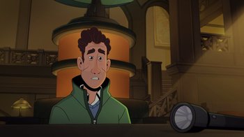 Movie still from “Night at the Museum: Kahmunrah Rises Again” (2022), directed by Justin Lovell – A man in a green jacket sitting in front of a clock; Medium shot, Over the shoulder angle