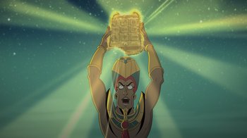 Movie still from “Night at the Museum: Kahmunrah Rises Again” (2022), directed by Justin Lovell – An animated character holding a piece of food in his hands; Medium shot, Low angle