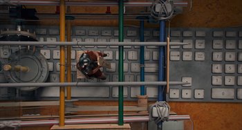 Movie still from “Night at the Museum: Secret of the Tomb” (2014), directed by Shawn Levy – A person riding a skateboard down a ramp; Extreme Wide shot, Overhead angle
