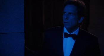 Movie still from “Night at the Museum: Secret of the Tomb” (2014), directed by Shawn Levy – A man in a suit and a bow tie looking up; Medium shot, Over the shoulder angle