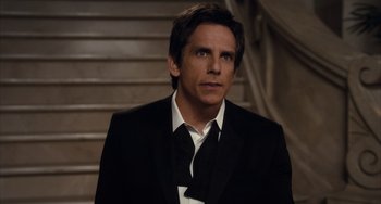 Movie still from “Night at the Museum: Secret of the Tomb” (2014), directed by Shawn Levy – Ben stiller in a suit and tie in front of a staircase; Close Up shot, Over the shoulder angle